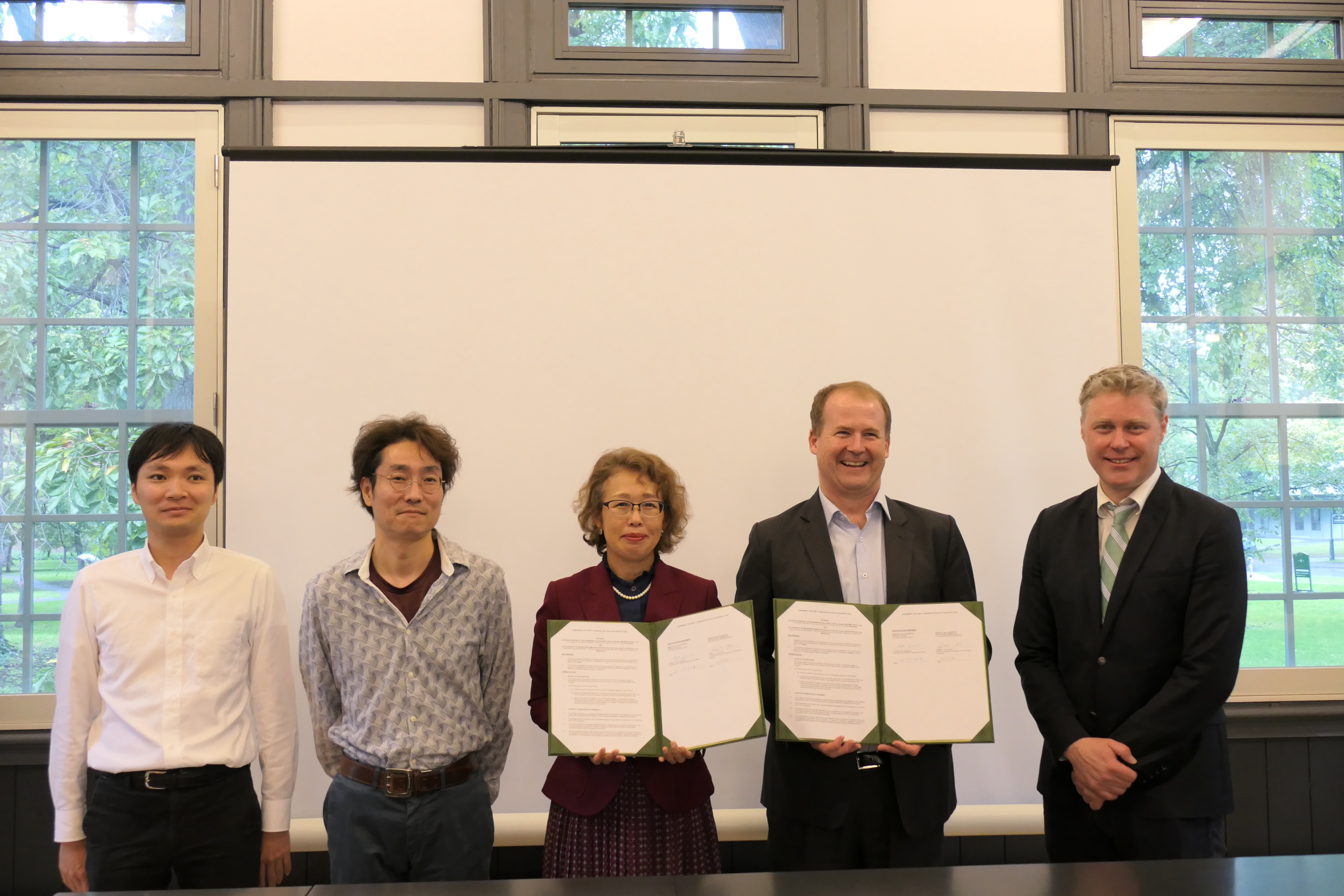 University of Melbourne Professor Mark Cassidy (second from the right) and the Heads of the Research Institute for Electronic Sciences, University of Hokkaido.