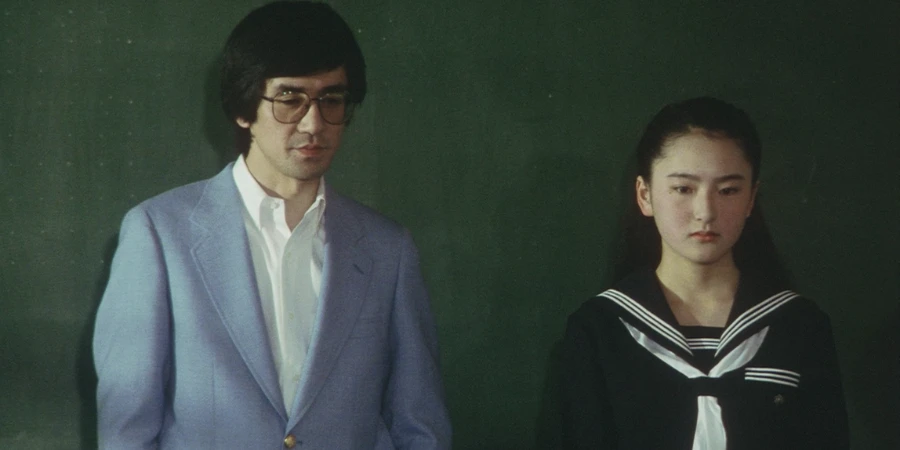 A teacher and a new student, who is about to introduce herself to the class