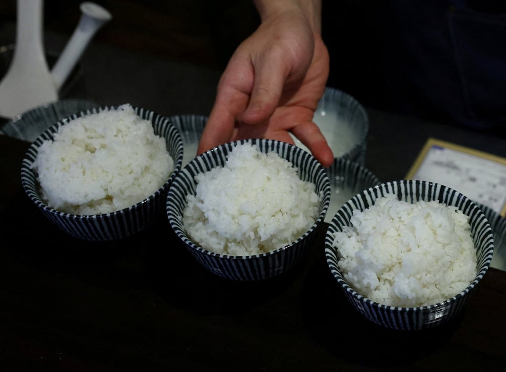 A chef prepares bowls of cooked rice for customers at a restaurant in Tokyo. Retail prices for Japan’s staple grain are about double what they were a year ago. Photo: Reuters