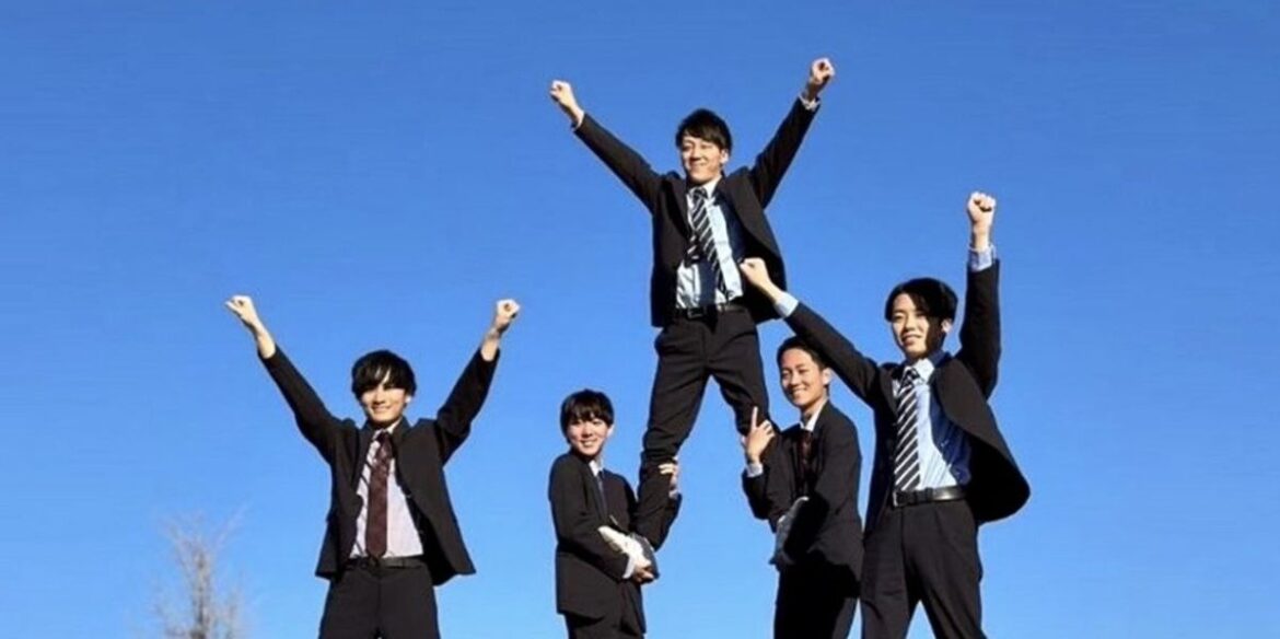 How a group of Japanese business men in suits became a beloved cheerleading squad