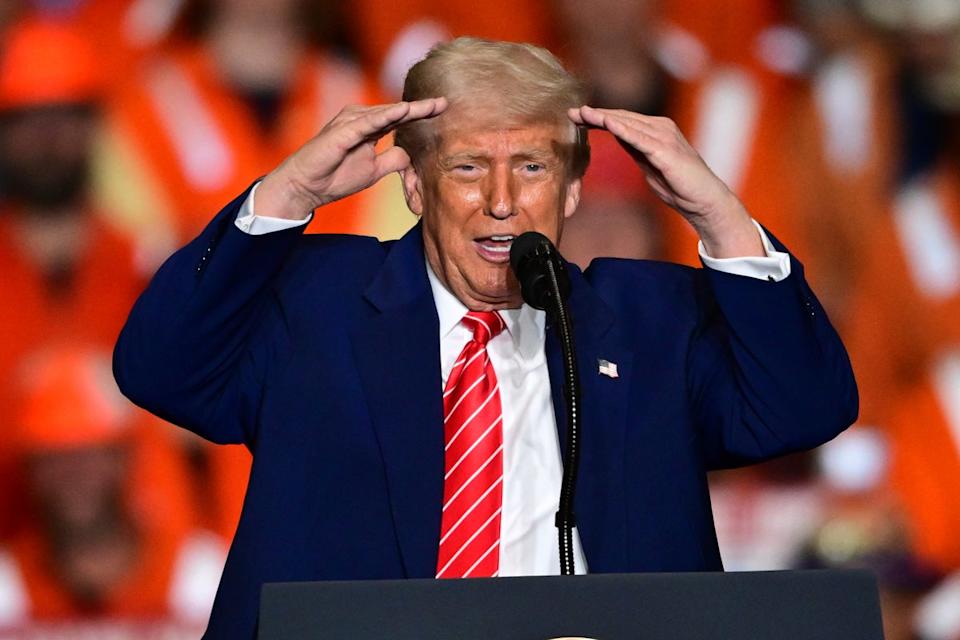 Trump celebrated a deal between U.S. Steel and Nippon as he announced higher tariffs on foreign steel (AP)