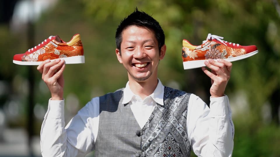 Shotaro Kawamura, photographed in 2022, with his initial launch of kimono shoes. - CNN