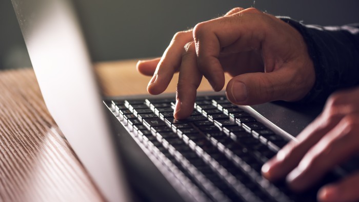 Japan arms itself against foreign cyber attacks with new law Hands on a laptop keyboard