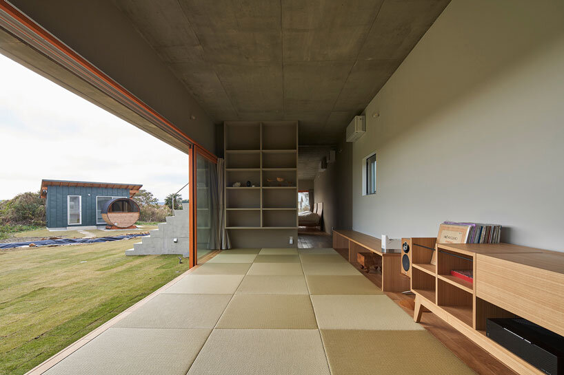 concrete isumi villa by takeshi hosaka architects organically spreads over land in japan