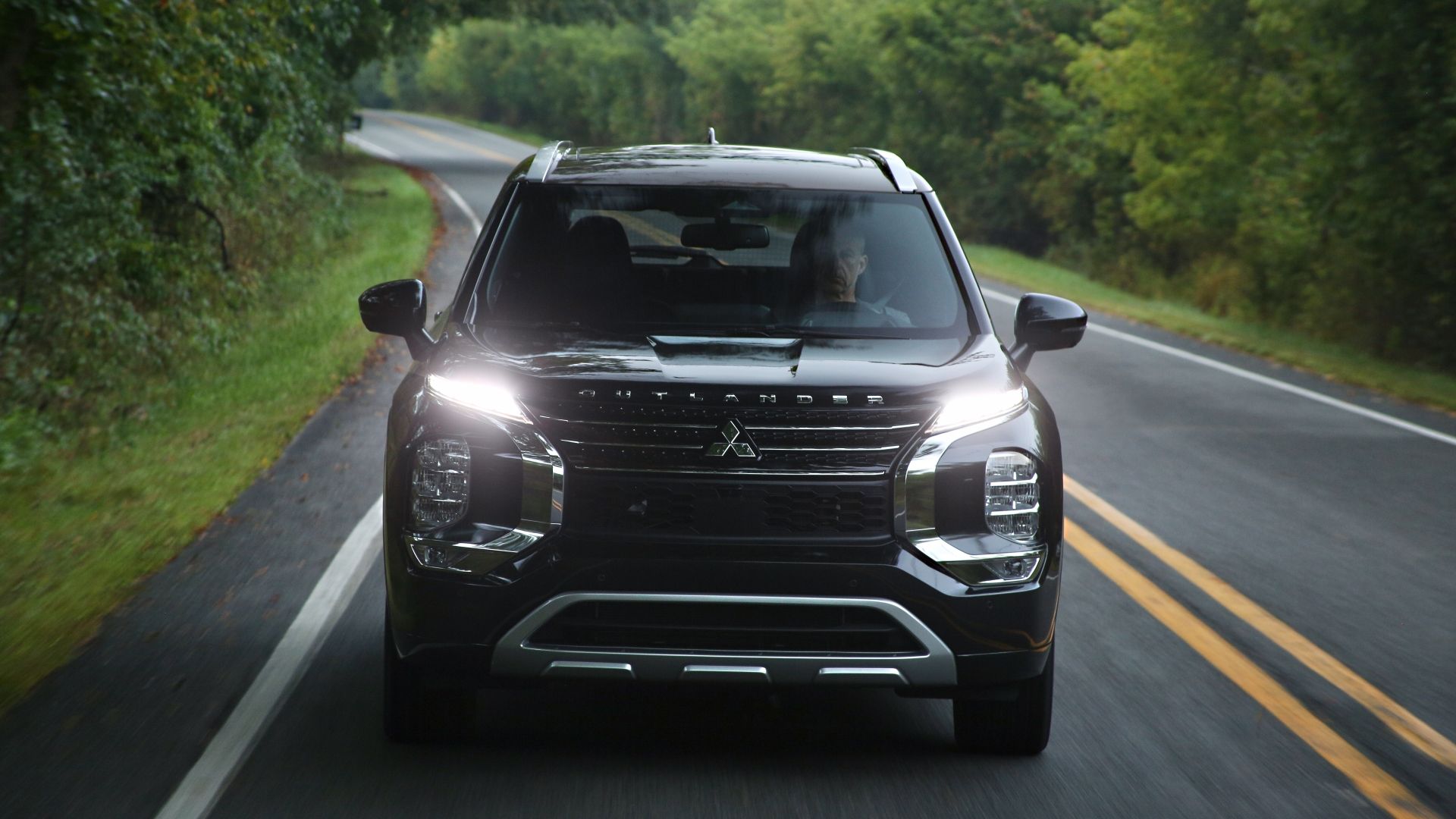 Head on action shot of a 2023 Mitsubishi Outlander