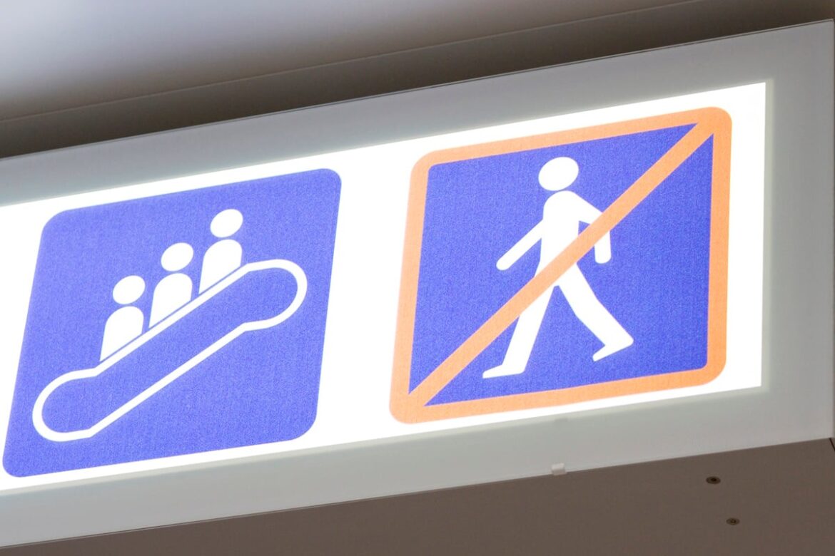 Will Japan (Finally) Start Standing on Both Sides of The Escalator? Sign showing standing on the escalator and prohibiting walking