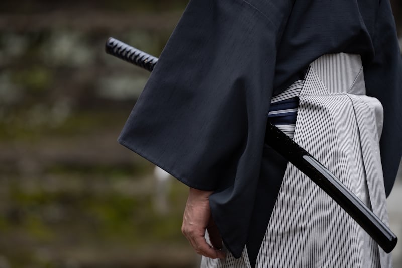 Man with a samurai sword worn on his left side