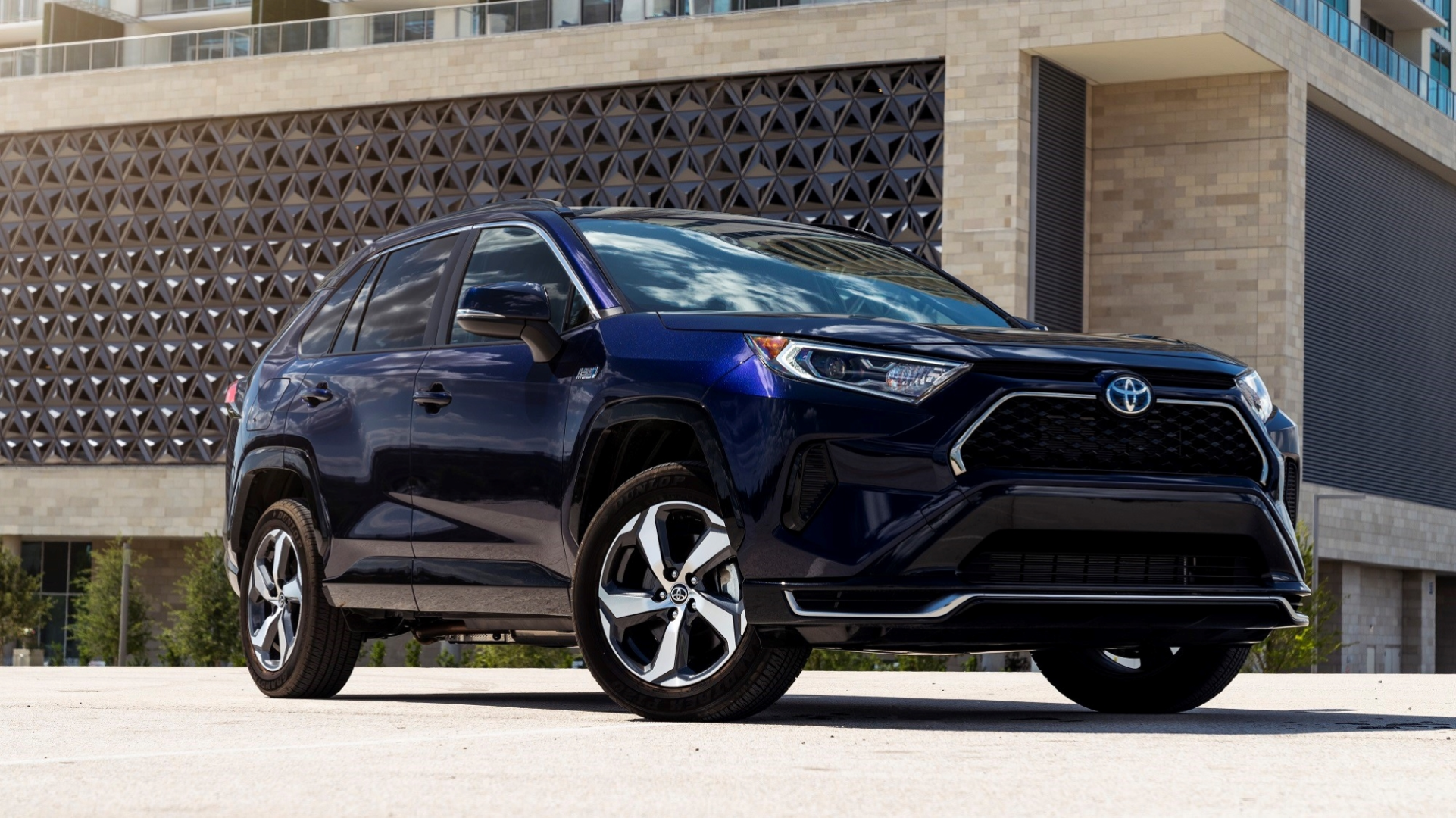 A front 3/4 shot of a 2023 Toyota RAV4 Prime showing off its alloy rims