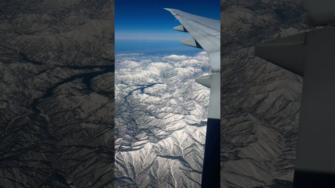 Magnificent view of Japan's snow-covered mountain ranges #travel  #japan  #shorts #windowview