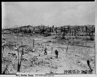 This photo taken May 29, 1945, by U.S. forces shows the ruins of the former town of Shuri. Shuri Church is visible in the distance at the center. (Photo from the Okinawa Prefectural Archives)