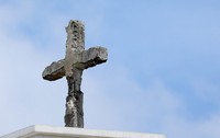 The photo taken in Naha on May 21, 2025, shows the cross of Shuri Church, which was restored in 2017. The restoration replicated its state during the Battle of Okinawa, conveying the horrors of war. (Mainichi/Shinnosuke Kyan)