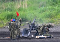 Infantry troops fire a mortar during the Fuji Firepower Exercise at the Ground Self-Defense Force's Higashi-Fuji Maneuver Area in Shizuoka Prefecture, June 8, 2025. (Mainichi/Natsuki Nishi)