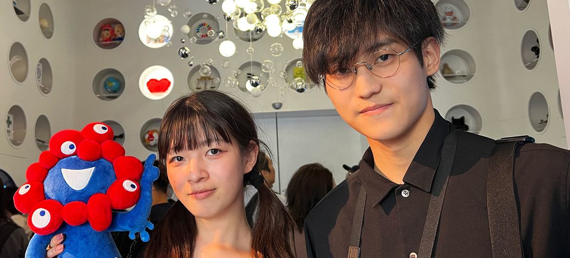 Agaka Sato (left) and Takato Ishida explore the orb room in the UN Pavilion.