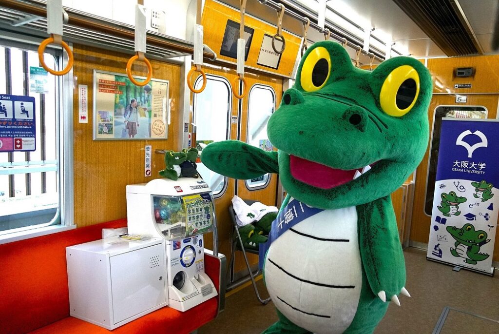 Dr. Wani made an appearance at the Kita-Osaka Express Line Extension First Anniversary Festival! - The University of Osaka Dr. Wani made an appearance at the Kita-Osaka Express Line Extension First Anniversary Festival! - The University of Osaka