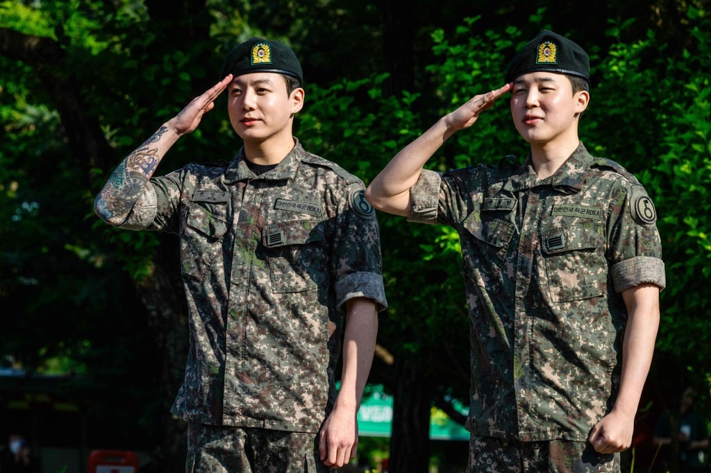 BTS members Jungkook and Jimin salute at a sporting facility in Yeoncheon on June 11, shortly after completing their 18-month mandatory military service. Photo: AFP