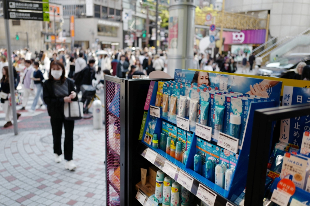 A major drug chain store in the Tokyo’s bustling Shibuya district displaying various sunscreen products on shelves. — AFP pic