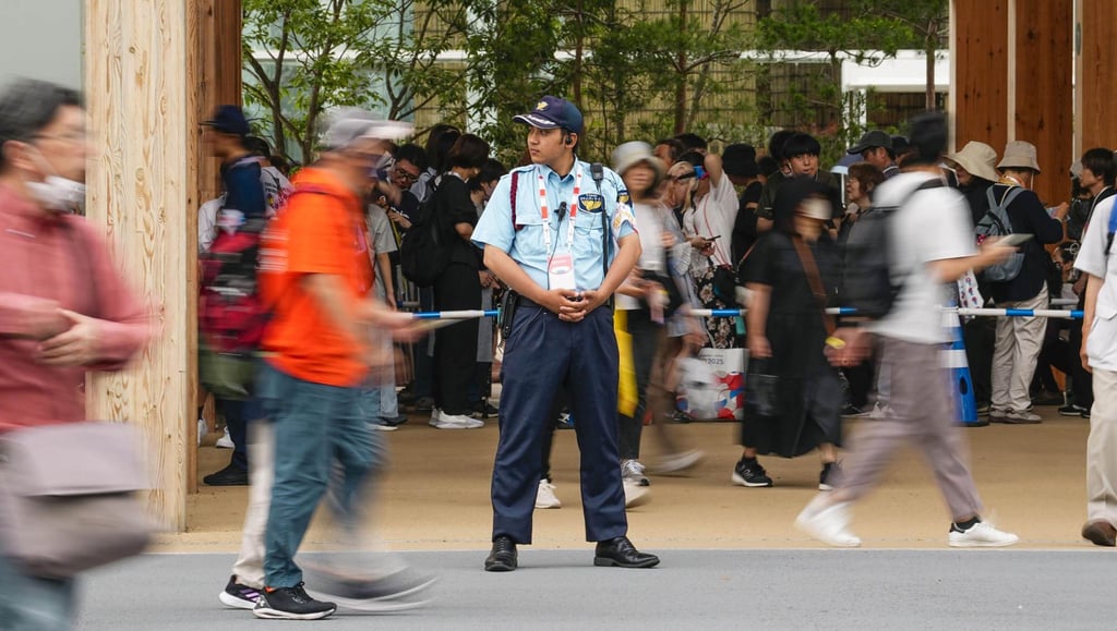 A security guard watches over visitors at the World Expo in Osaka last week. Photo: Kyodo