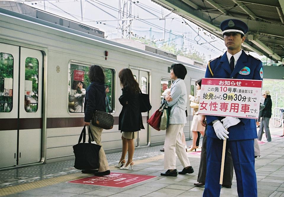 Women lined up at womens only train car