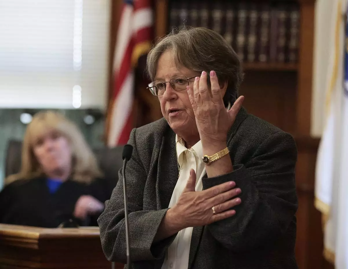 Forensic pathologist Dr. Marie Russell testifies about the type of injuries to the back of someone's arm during the murder retrial of Karen Read in Norfolk Superior Court, Monday June 2, 2025, in Dedham, Mass. (Pat Greenhouse/The Boston Globe via AP, Pool)