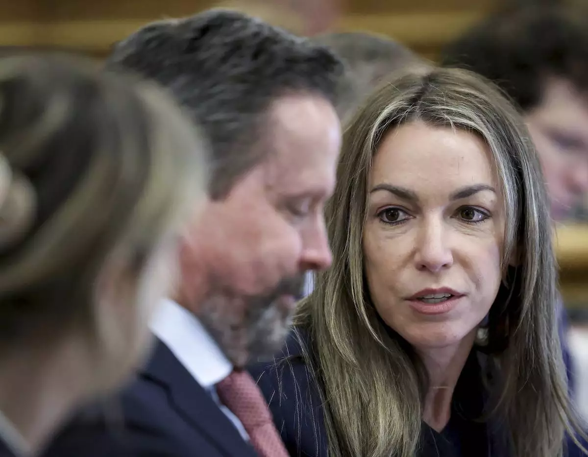 Defendant Karen Read speaks with her attorney Alan Jackson during her murder trial in Norfolk Superior Court in Dedham, Mass., Friday, May 30, 2025. (Mark Stockwell/The Sun Chronicle via AP, Pool)