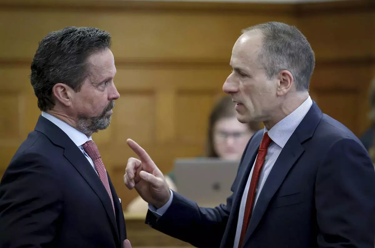 Defense attorneys Alan Jackson, left, and David Yannetti, right, confer before the start of Karen Read's murder trial in Norfolk Superior Court in Dedham, Mass., Friday, May 30, 2025. (Mark Stockwell/The Sun Chronicle via AP, Pool)