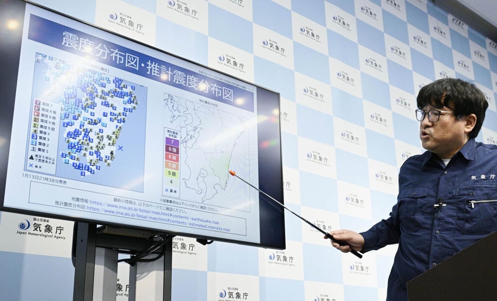 A Japan Meteorological Agency official points to a map showing a magnitude 6.6 earthquake off the southwestern Japan prefecture of Miyazaki in January. Photo: Kyodo