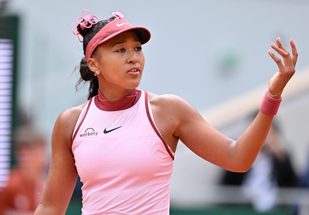 Naomi Osaka of Japan plays against Paula Badosa of Spain during the Women's Singles First Round match on Day Two of the 2025 French Open at Roland Garros Stadium.