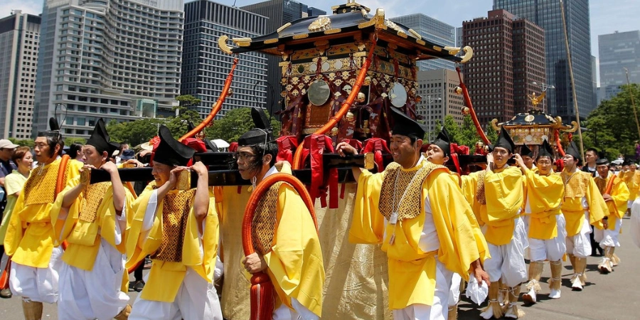 Men in yellow doing a procession