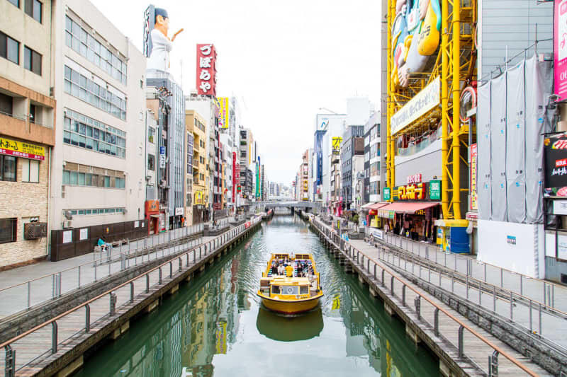 If you want to explore Dotonbori from a more tranquil side, take a trip on one of the excursion boats on the canal. Osaka Convention & Tourism Bureau/dpa