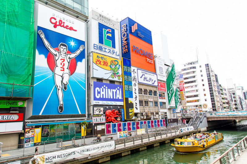 Glico Man, an iconic set of neon signs near the Ebisu Bridge, is Osaka's answer to Tokyo's Ginza ad-packed shopping district. Osaka Convention & Tourism Bureau/dpa