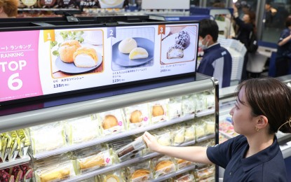 <p><strong>AI SHOPPING.</strong> A digital display shows product information in response to customer actions at Lawson's "convenience store of the future" in Tokyo's Minato Ward on Monday (June 23, 2025). The store, located in the Takanawa Gateway City complex, is the first of its kind to be run under the joint ownership of KDDI and general trader Mitsubishi Corp. <em>(Jiji Press photo)</em></p>