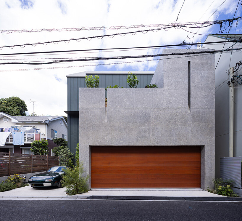 semicircular skylights cast sunbeams across takeshi hosaka's concrete residence in tokyo