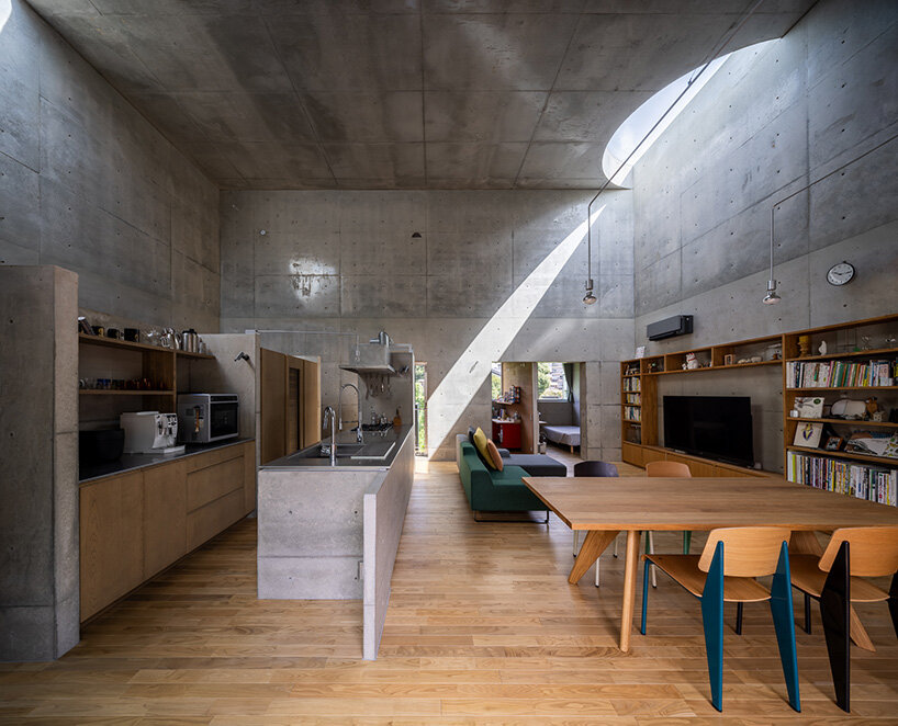 semicircular skylights cast sunbeams across takeshi hosaka's concrete residence in tokyo