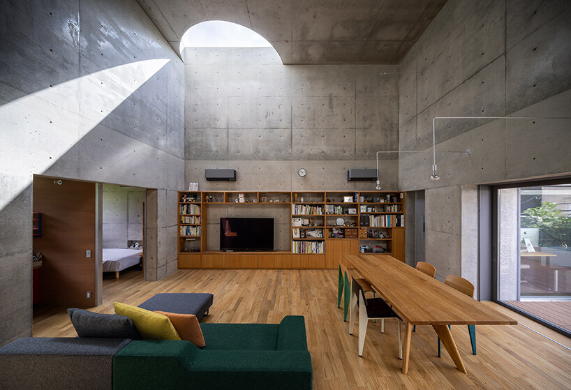 semicircular skylights cast sunbeams across takeshi hosaka's concrete residence in tokyo