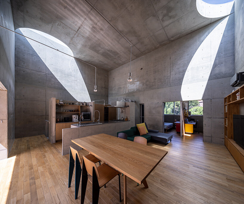 semicircular skylights cast sunbeams across takeshi hosaka's concrete residence in tokyo