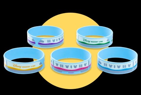 Five colorful Limited-Time Tokyo Disney Resort Line wristbands arranged in a circle on a yellow background.