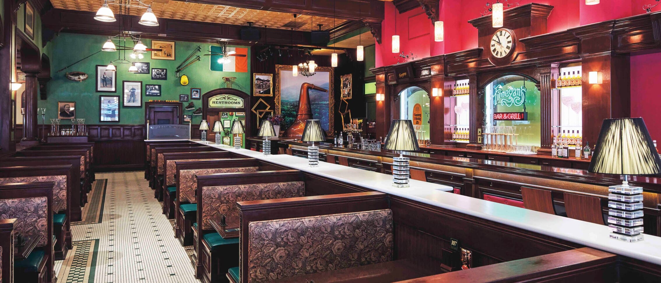 Vintage-style diner with wooden booths, retro lamps, and photos—like Finnegan’s Bar & Grill at Universal Studios Japan.