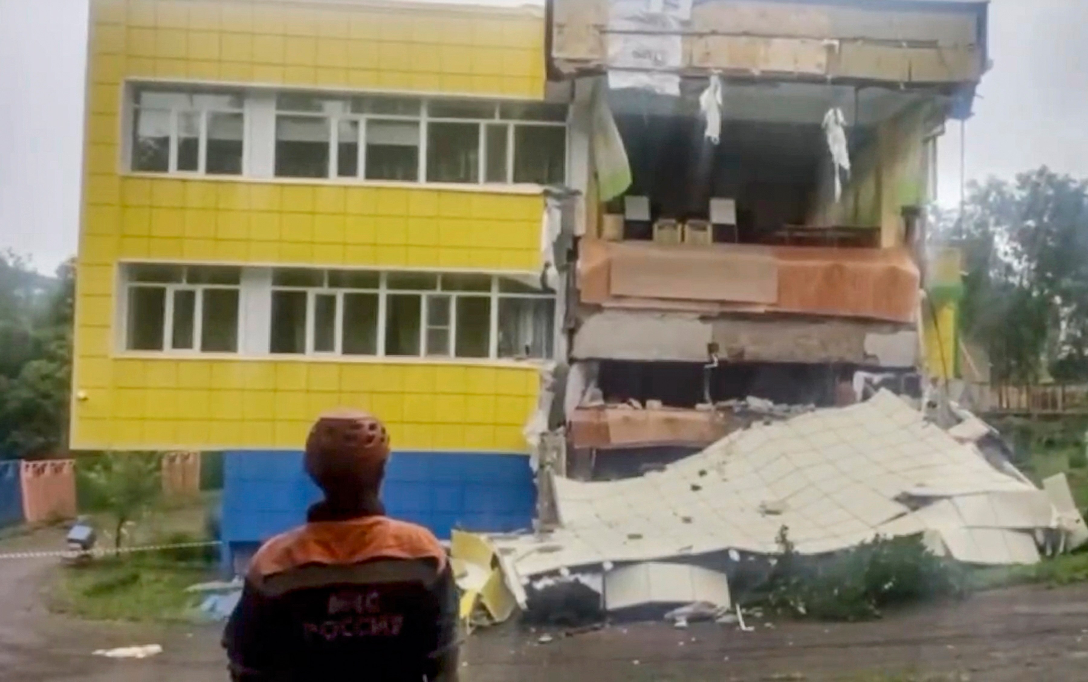Rescuer near earthquake-damaged kindergarten in Petropavlovsk-Kamchatsky.