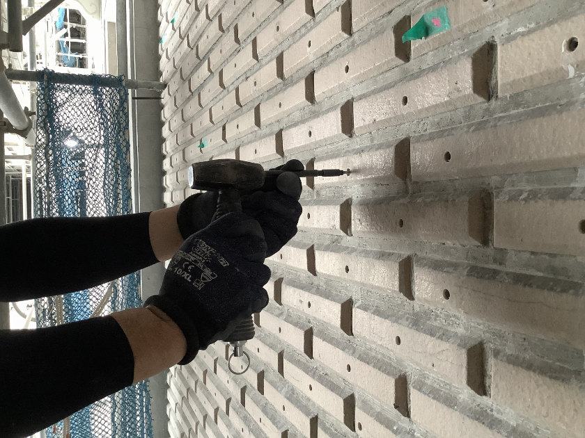 Tiles being screwed in