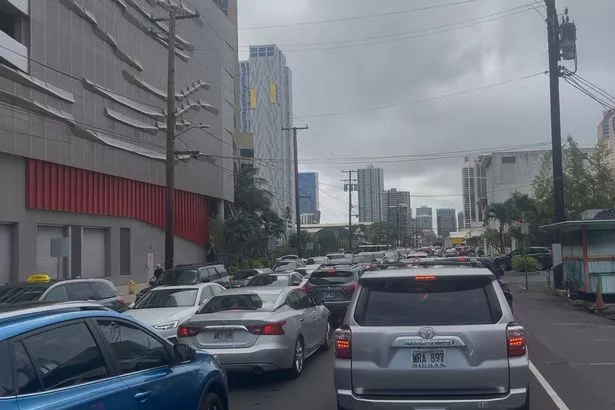 A traffic jam forms in Honolulu Tuesday, July 29, 2025 as people heed a tsunami evacuation warning that coincided with rush hour following a powerful earthquakes in Russia's Far East early Wednesday