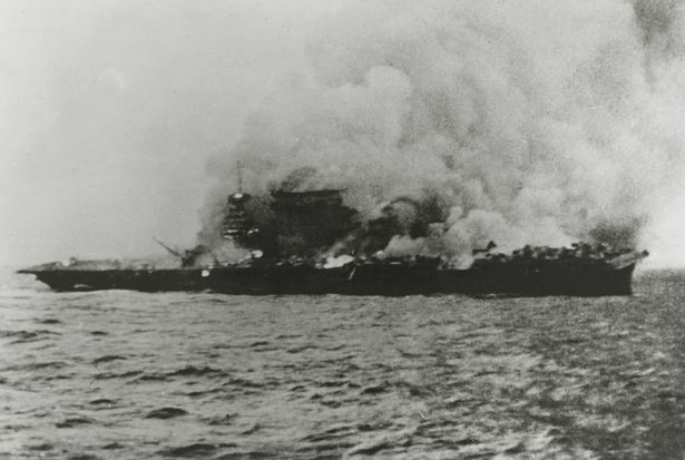 The American aircraft carrier USS "Lexington" burning fiercely during the battle with the Japanese at the Batle of the Coral Sea