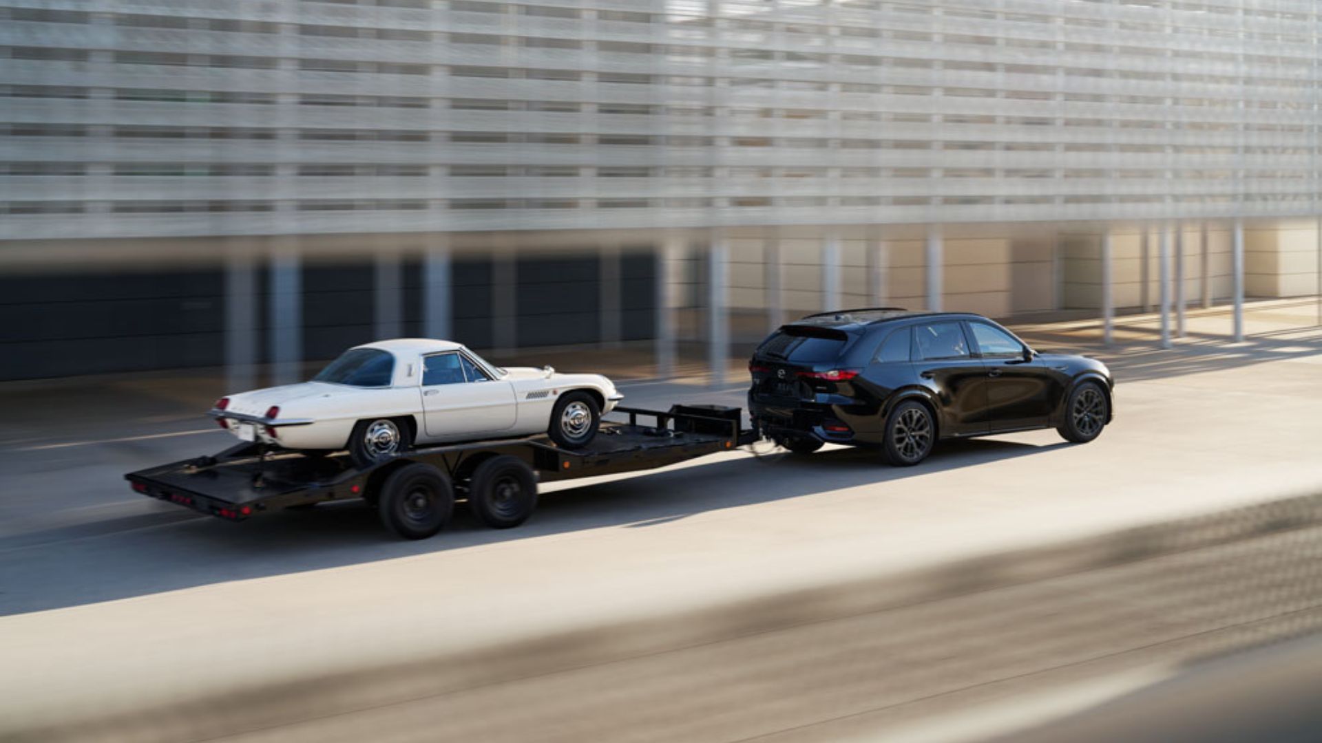 2025 Mazda CX-70 towing a car