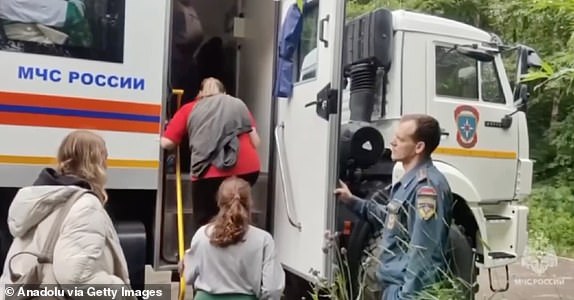 SAKHALIN OBLAST, RUSSIA - JULY 30: (----EDITORIAL USE ONLY MANDATORY CREDIT - 'RUSSIAN MINISTRY OF EMERGENCY SITUATIONS/ HANDOUT' - NO MARKETING NO ADVERTISING CAMPAIGNS - DISTRIBUTED AS A SERVICE TO CLIENTS----) A screen grab from a video shows people being evacuated after magnitude 8.8 earthquake hits Kamchatka Peninsula and a tsunami partially flooded the area, including the grounds of the Alaid fishing enterprise, on July 30, 2025 in Sakhalin Oblast, Russia. The evacuation was carried out under the supervision of Russia's Ministry of Emergency Situations in the Sakhalin Region. In Kamchatka, about 60 vacationers were evacuated from Khalaktyrsky Beach with the help of three cross-country vehicles. No significant rise in water levels was recorded in nearby settlements. Civilians evacuated from the port of Severo-Kurilsk after a tsunami partially flooded the area. (Photo by Russia Min. of Emergency Situations / Handout/Anadolu via Getty Images)