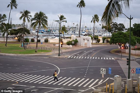 HONOLULU, HAWAII - JULY 29: A pedestrian crosses and empty Ala Moana Boulevard ahead of an anticipated tsunami on July 29, 2025 in Honolulu, Hawaii. Parts of the US west coast and Japan are being evacuated after a Tsunami warning following one of the strongest earthquakes in modern history hit Russia's eastern Kamchatka Peninsula. (Photo by Darryl Oumi/Getty Images)
