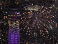 Fireworks are seen near Tokyo Skytree, left, during the Sumida River Fireworks Festival in Tokyo on July 26, 2025, in this photo taken from a Mainichi Shimbun helicopter. (Mainichi/Koichiro Tezuka) 