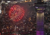 Fireworks are seen near Tokyo Skytree, right, during the Sumida River Fireworks Festival in Tokyo on July 26, 2025, in this photo taken from a Mainichi Shimbun helicopter. (Mainichi/Koichiro Tezuka) 