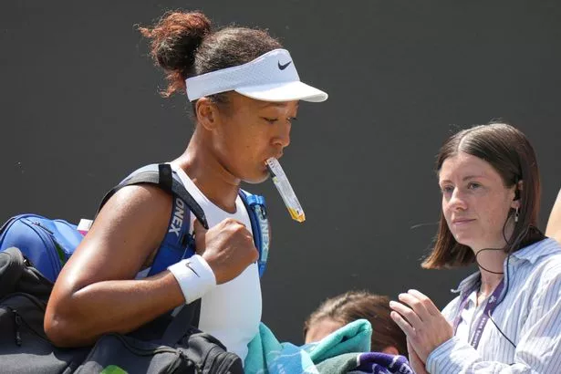 Naomi Osaka of Japan leaves the court after losing to Russia's Anastasia Pavlyuchenkova during a third round women's singles match at the Wimbledon Tennis Championships in London