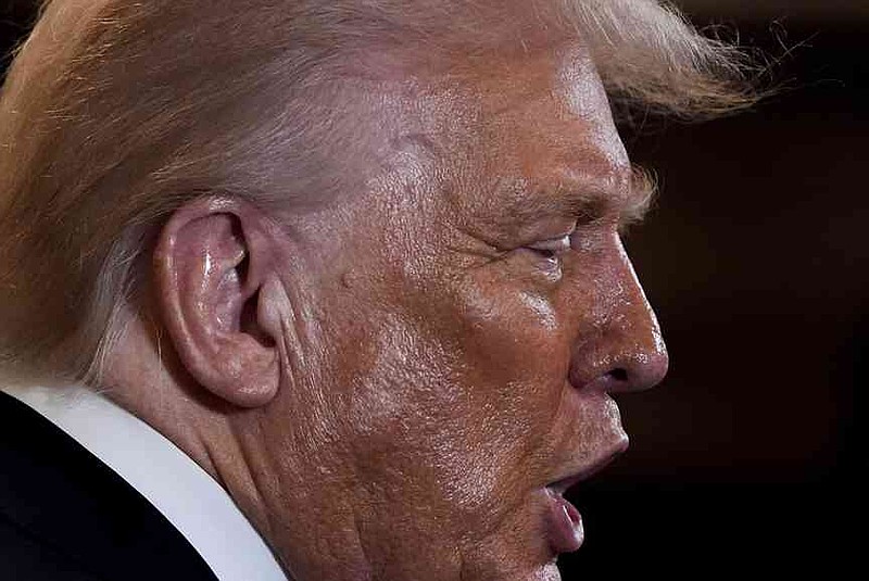 President Donald Trump greets people during a reception for Republican members of Congress in the East Room of the White House, Tuesday, July 22, 2025, in Washington. (AP Photo/Julia Demaree Nikhinson)