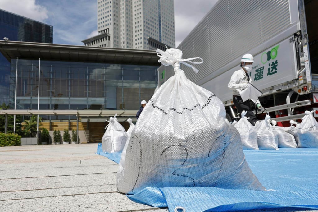 A bag of slightly radioactive but decontaminated soil from Fukushima, is delivered to the Japanese prime minister’s office on Saturday. Photo: AP