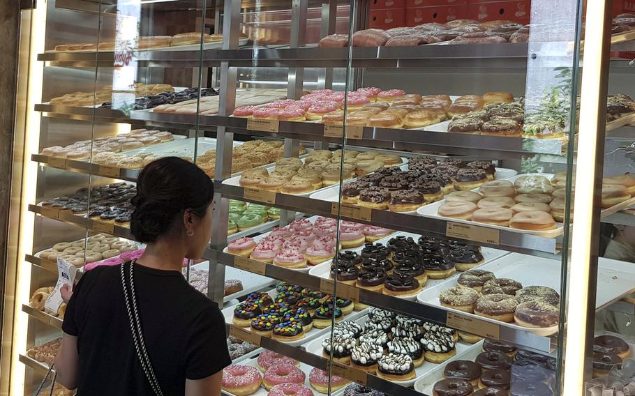 A customer browses the selection at Randy’s Donuts in Tokyo, June 28, 2025.